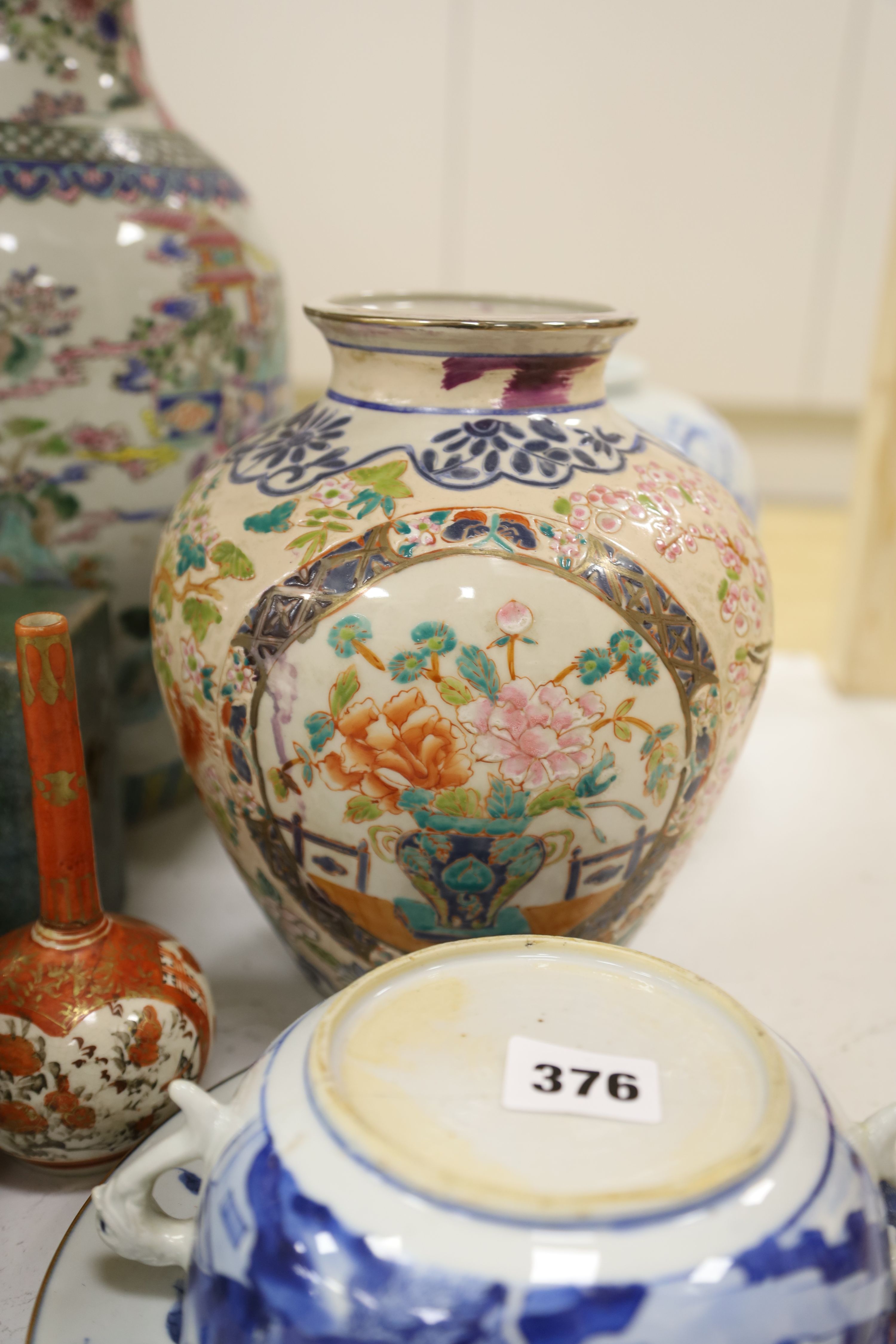 A Chinese famille rose vase, two teapots, mixed Chinese and Japanese ceramics and a lamp